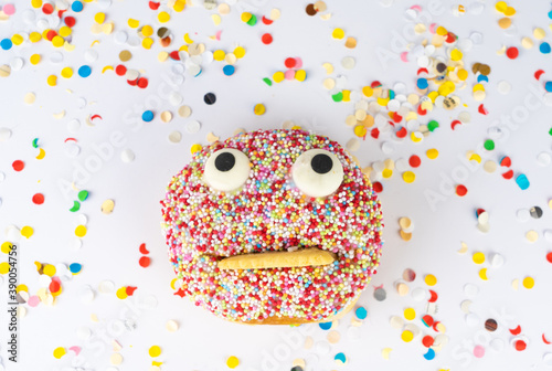 Funny face cake with confetti background