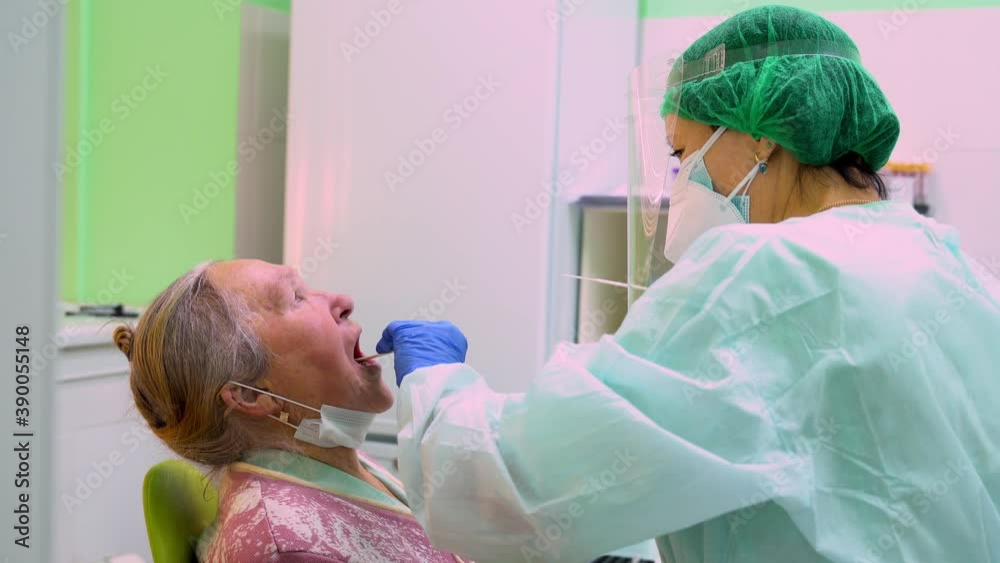 Taking A Medical Sample - A Throat Swab For A Coronavirus Test. A Nurse ...