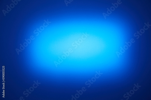 Light blue rounded cloud of light on blue background