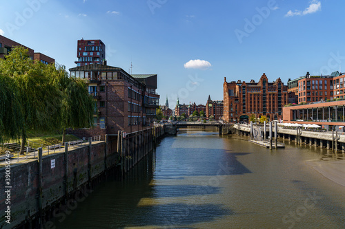 HAMBURG, GERMANY - Aug 11, 2020: Magdeburg harbor and Busan bridge with the Speicherstadt and Hamburg City photo