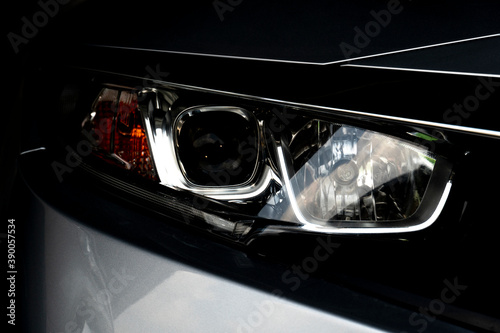 Abstract and close up of dark tone luxury car headlights. for transtport technology background. photo