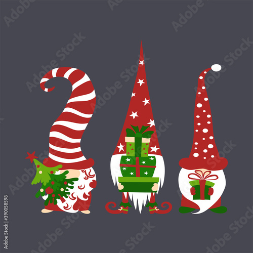 Three cute scandivaian christmas gnomes holding gift boxes and tree on dark grey background.