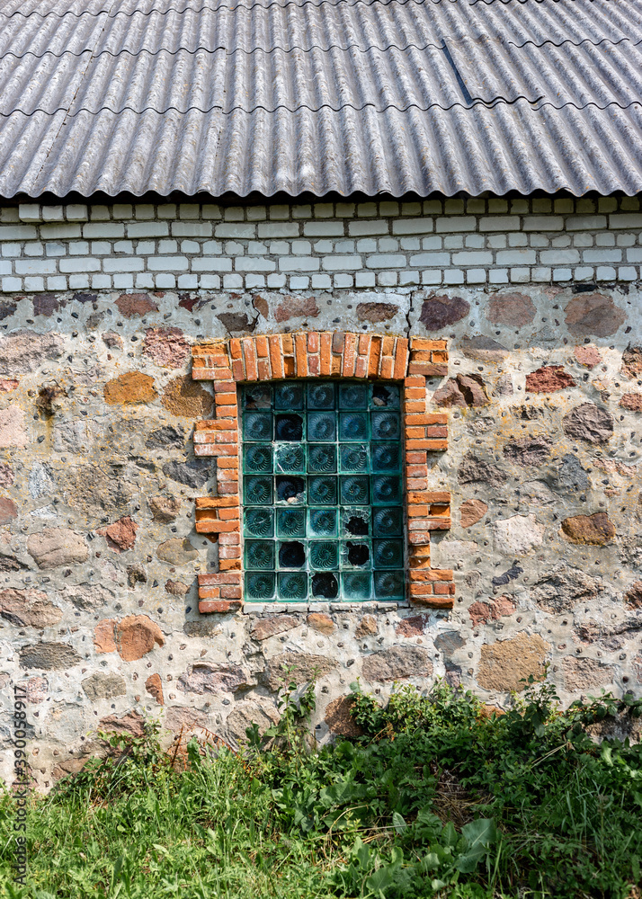 Glass block window in an old stone building Glass block window in an old stone building