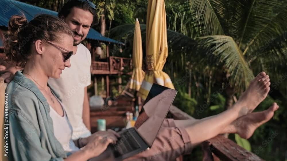 A young, handsome man discusses working moments while working with a beautiful freelance woman while working on a joint project. A young, handsome man discusses working moments while working with a beautiful freelance woman while working on a joint project.