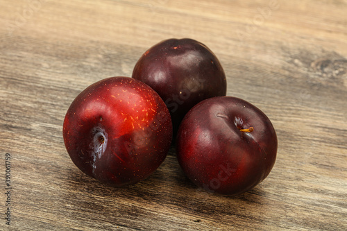 Ripe sweet plum fruit heap