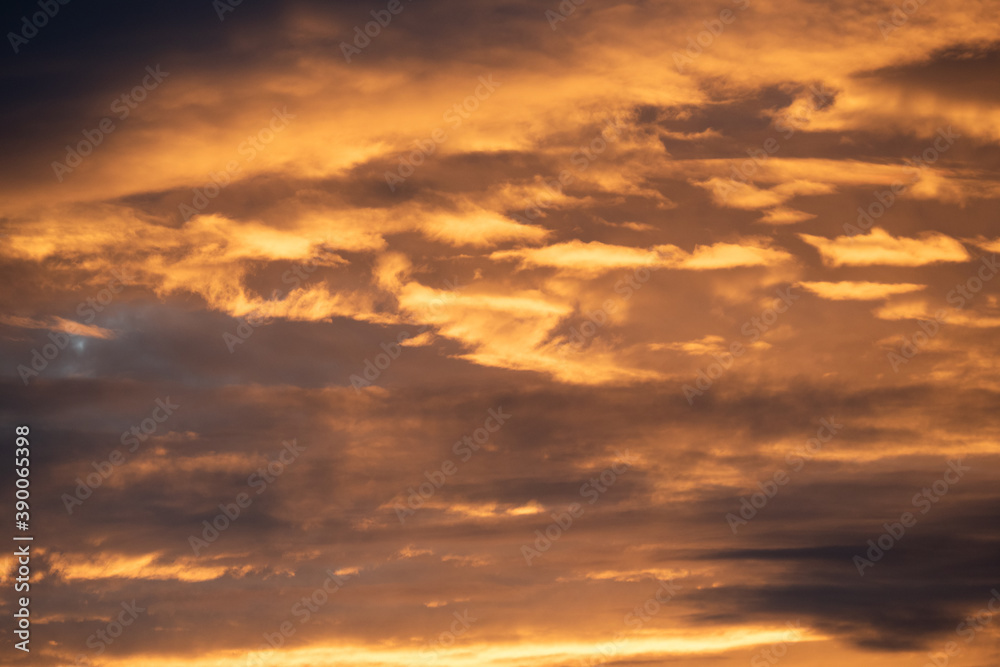 Dense grey clouds are partially colored reddish during a sunset, sky wallpapers