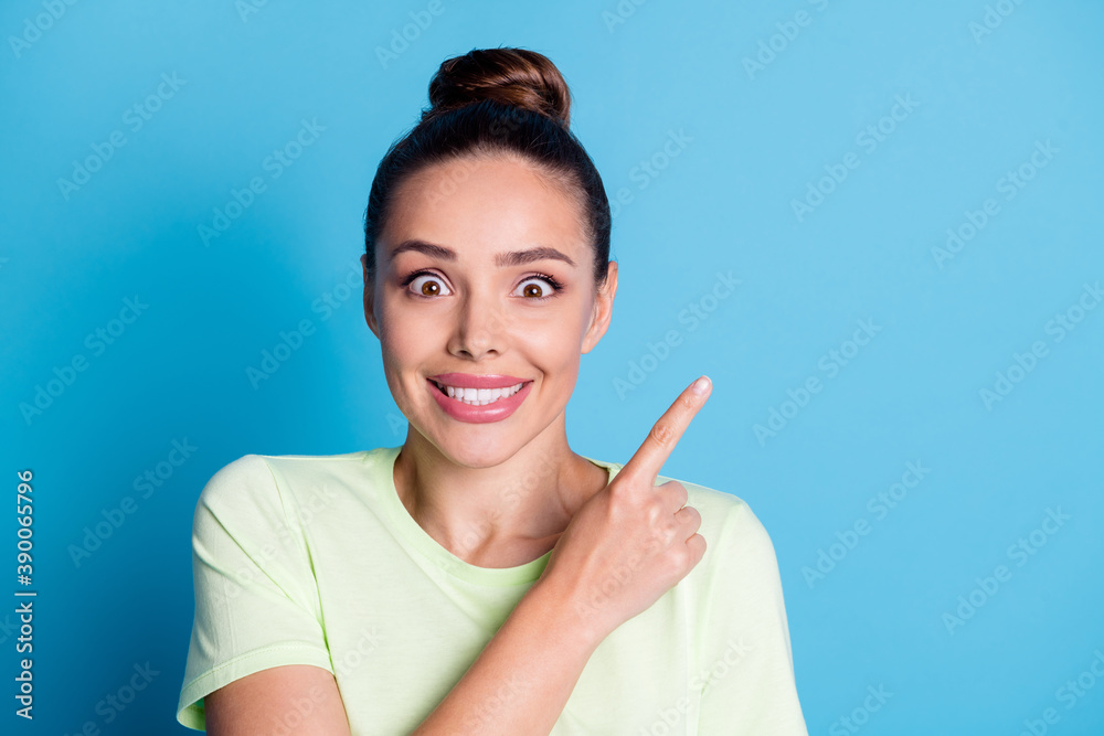Photo of surprised enjoy lady point index finger empty space isolated over blue pastel color background Photo of surprised enjoy lady point index finger empty space isolated over blue pastel color background
