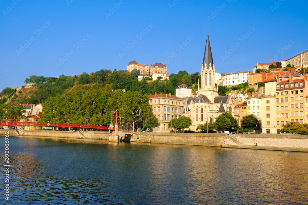 Obraz premium View of Saone river embankment with Saint George church. Lyon, France.