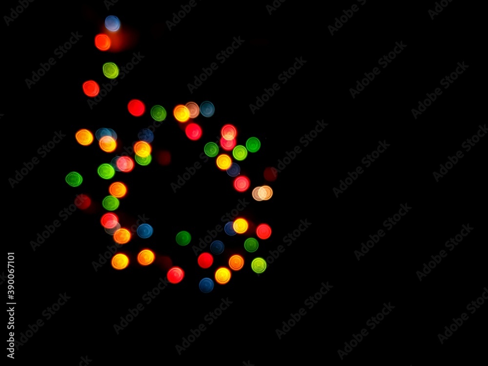 The multicolored side's or boke on a black background. Merry Christmas and happy New Year. Christmas background.