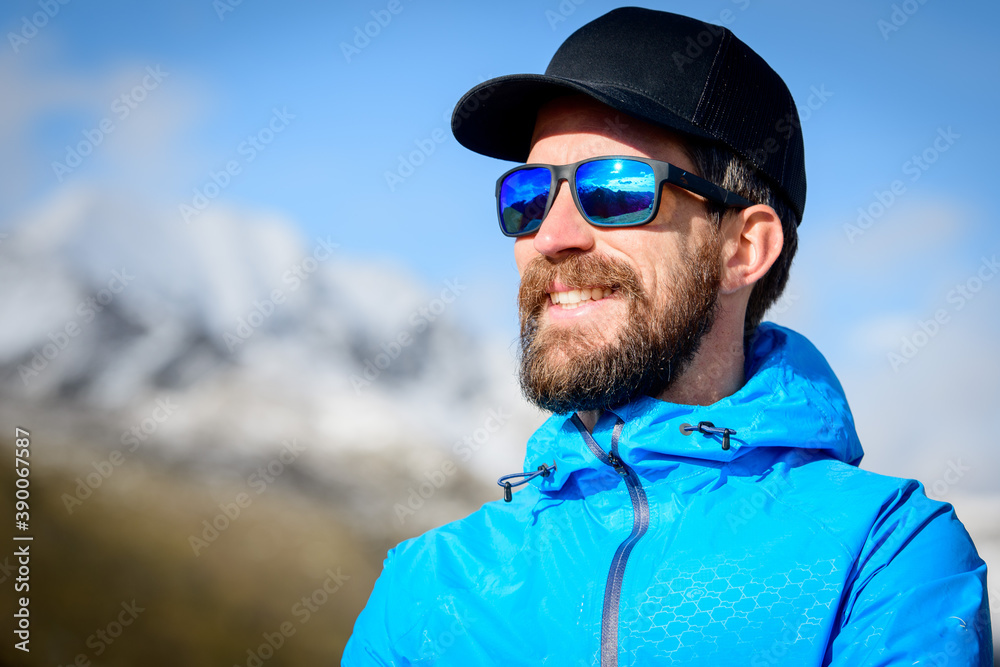 Portrait of sporty bearded man in the mountains Portrait of sporty bearded man in the mountains