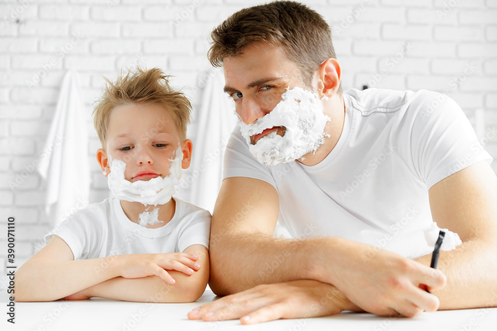 Father and his little son shaving together