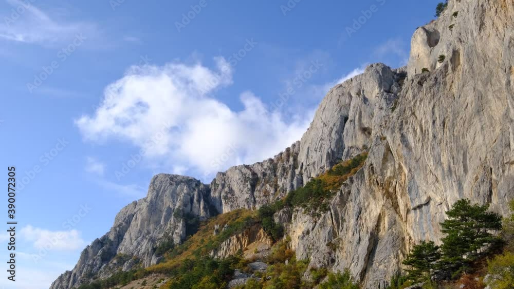 Beautiful landscape of blue sky with clouds in mountainous area. Clouds float, enveloping mountains. Autumn sunny day Beautiful landscape of blue sky with clouds in mountainous area. Clouds float, enveloping mountains. Autumn sunny day