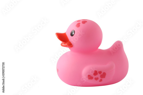 Pink rubber toy duckling on a white background, without shadow. Side view. With space for text.