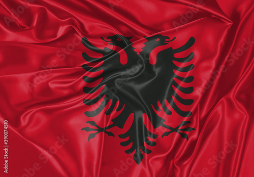 Albania flag waving in the wind. National flag on satin cloth surface texture. Background for international concept. photo