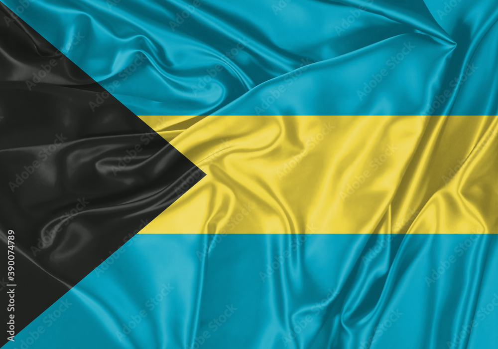 Bahamas flag waving in the wind. National flag on satin cloth surface texture. Background for international concept. Bahamas flag waving in the wind. National flag on satin cloth surface texture. Background for international concept.