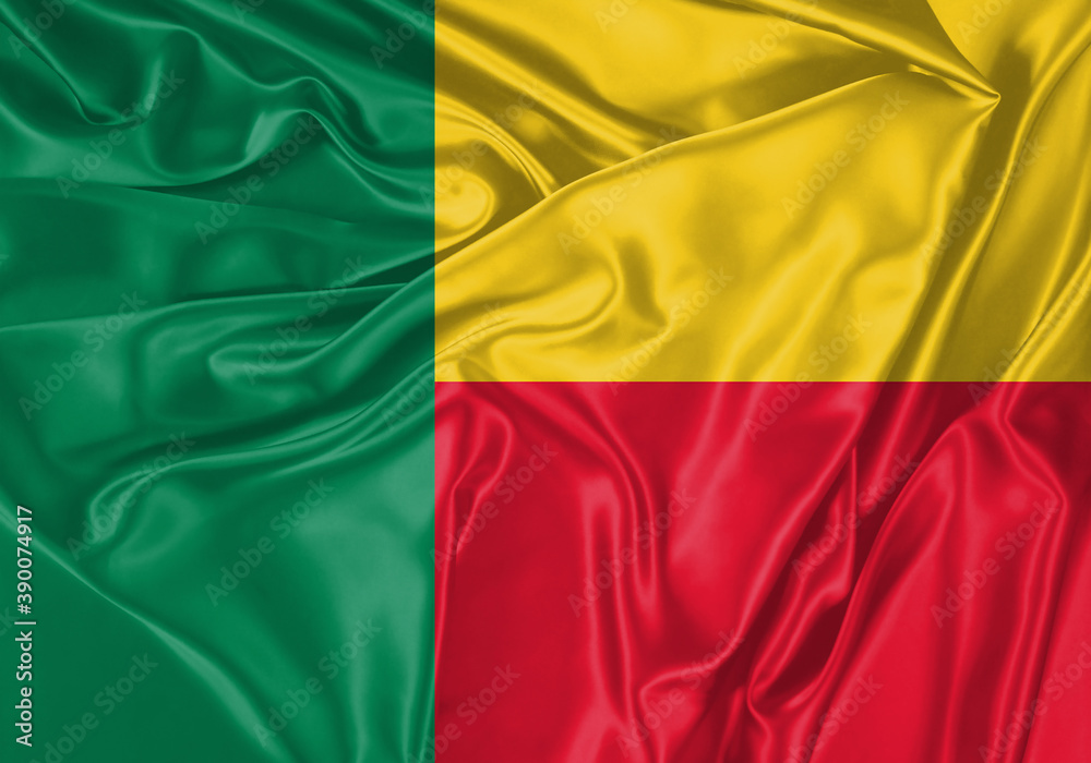 Benin flag waving in the wind. National flag on satin cloth surface texture. Background for international concept.