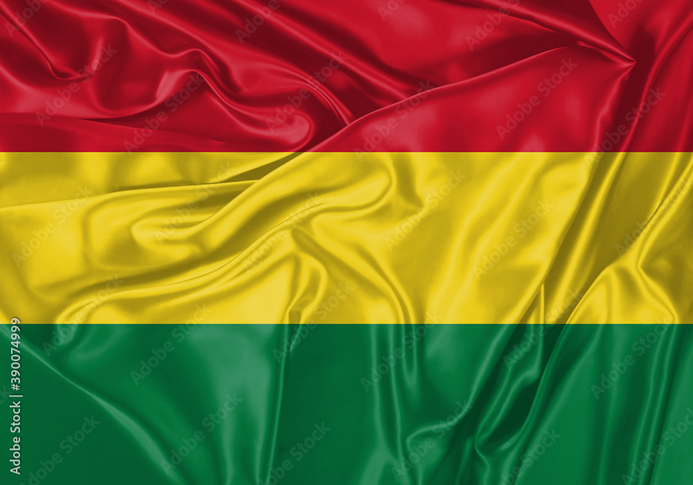 Naklejka premium Bolivia flag waving in the wind. National flag on satin cloth surface texture. Background for international concept.