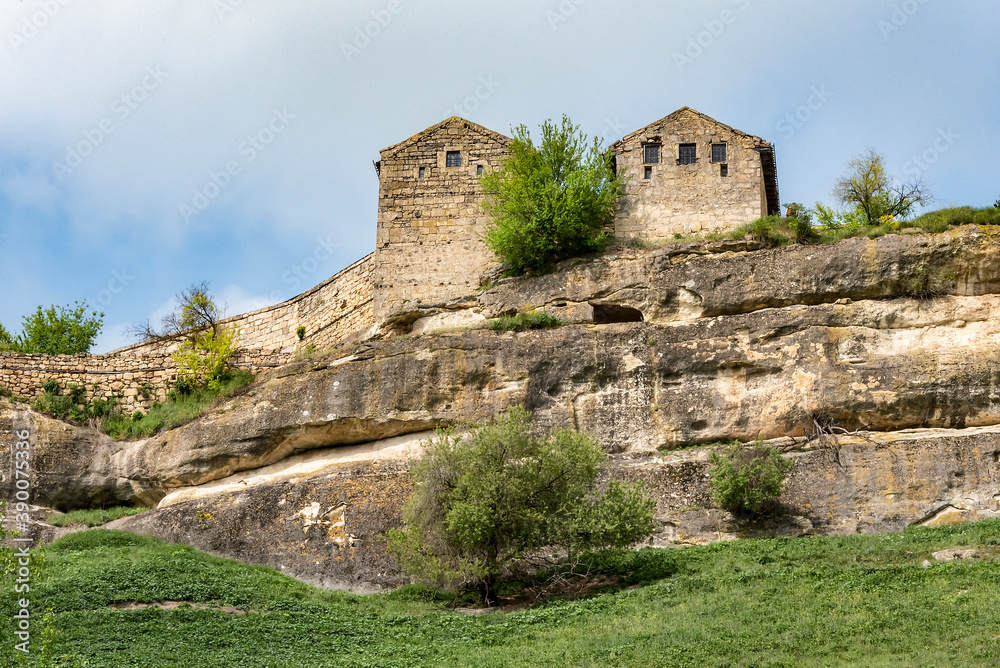 Medieval towers on a high cliff above the mountain valley in the famous ancient city-fortress Chufut-Kale (