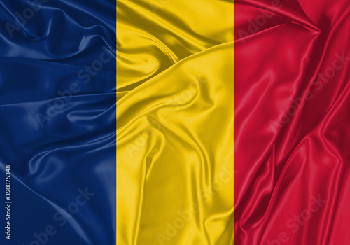 Chad flag waving in the wind. National flag on satin cloth surface texture. Background for international concept.
