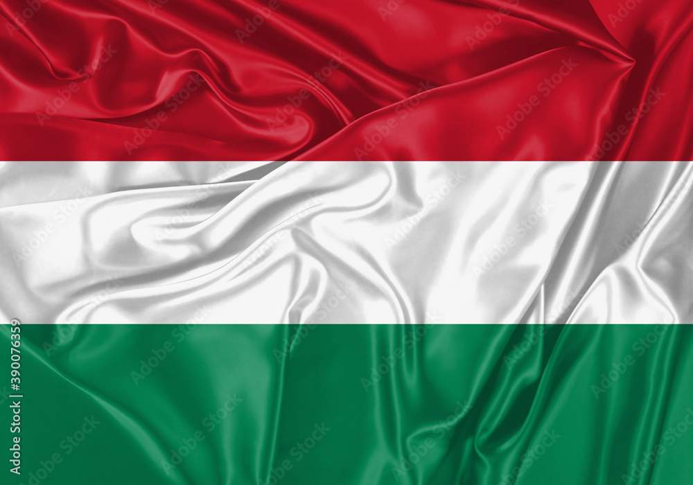 Hungary flag waving in the wind. National flag on satin cloth surface texture. Background for international concept.