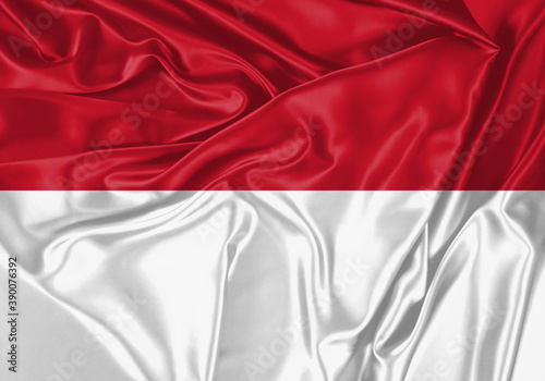 Indonesia flag waving in the wind. National flag on satin cloth surface texture. Background for international concept.