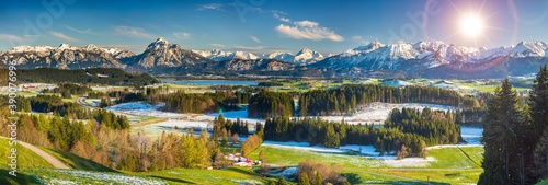 panoramic landscape in Bavaria with alps mountains and meadow at springtime