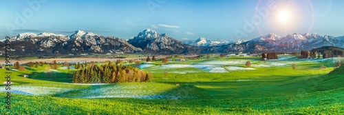 panoramic landscape in Bavaria with alps mountains and meadow at springtime