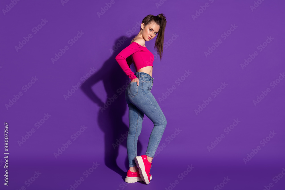 Full length body size profile side view of attractive slender skinny girl posing isolated on bright violet color background