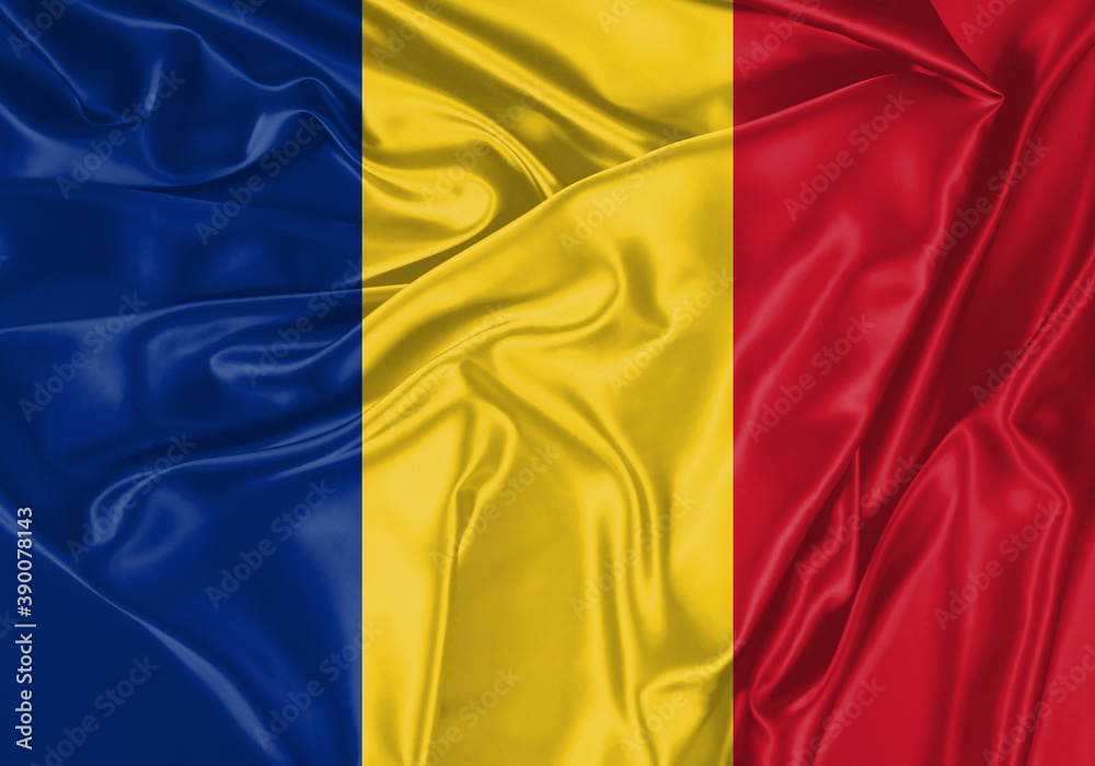 Romania flag waving in the wind. National flag on satin cloth surface texture. Background for international concept.