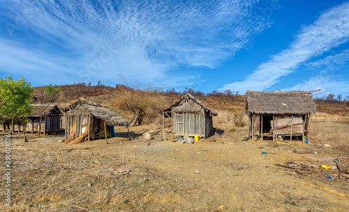 Traditional wooden african malagasy hut with roof from straw, typical village in north west Madagascar. Madagascar landscape. photo