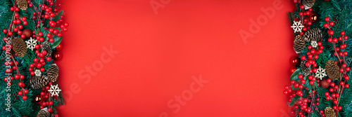 Christmas decorations on the red background with copy space for your text. Banner.