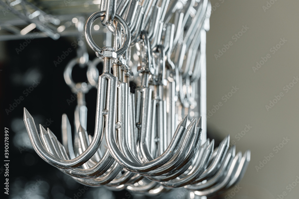 Metal hooks or hangers in a row in proffesional kitchen Metal hooks or hangers in a row in proffesional kitchen