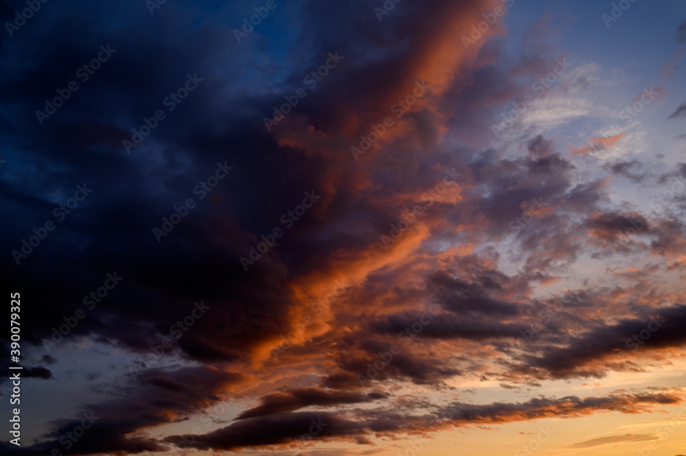 Sunset sky with orange clouds. Nature background.