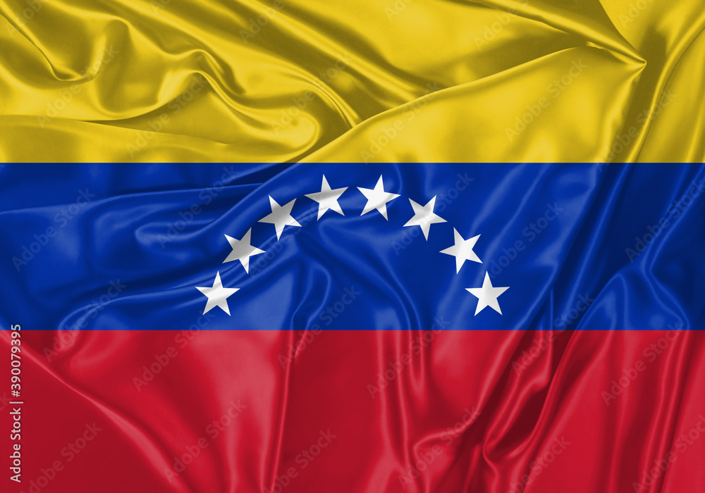 Venezuela flag waving in the wind. National flag on satin cloth surface texture. Background for international concept. Venezuela flag waving in the wind. National flag on satin cloth surface texture. Background for international concept.