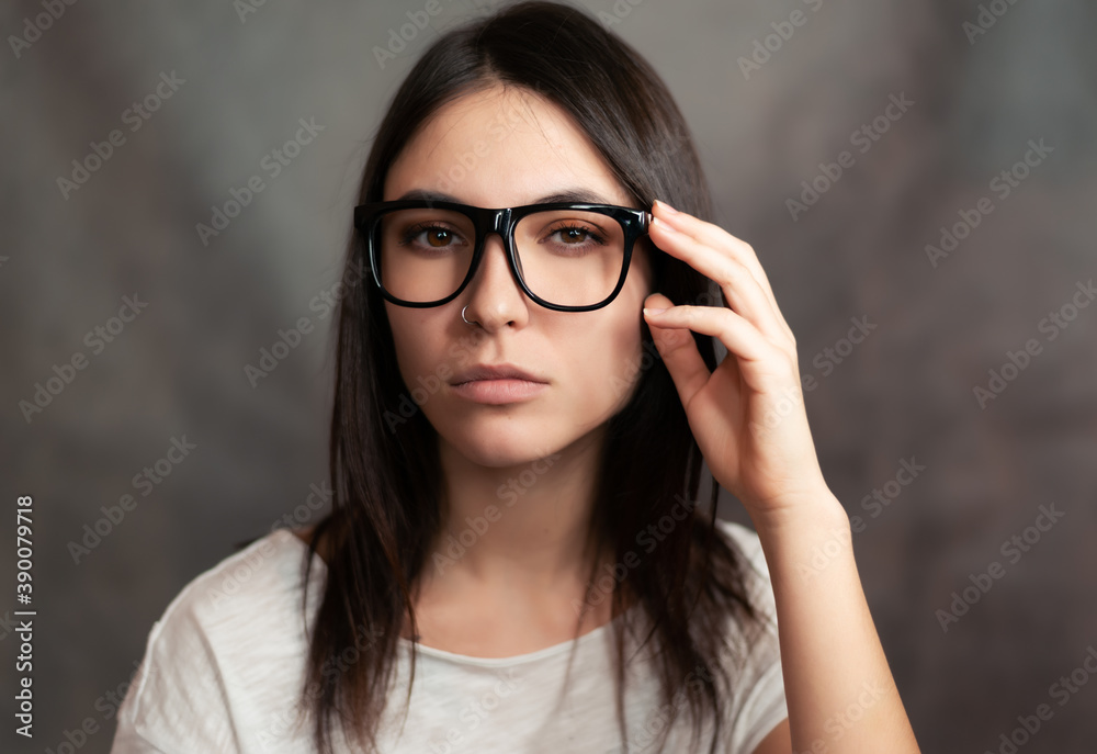 Portrait of woman wearing glasses. Selective focus.