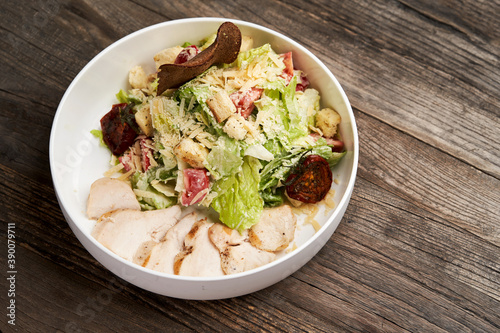 Caesar Salad with grilled chicken breast and parmesan cheese