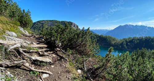 Wonderful vacations on the region Salzkammergut in Austria, Eur; hiking on the waterside  of the six lakes on the Tauplitz-Alm (alpine pasture); panoramic view with hills and reflections on the water. photo