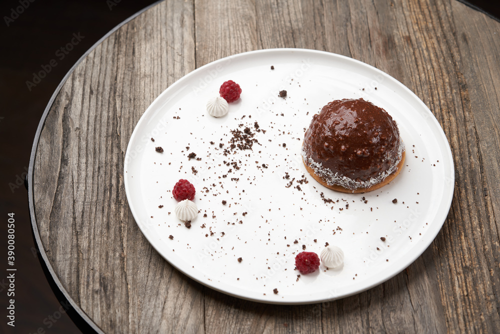 Fototapeta premium Malaga dessert cake with chocolate, walnuts, bananas