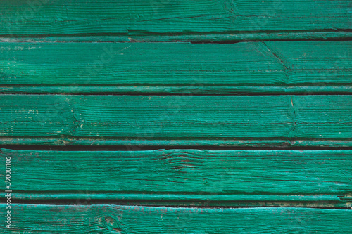 Surface of an empty green wooden background. old painted wall