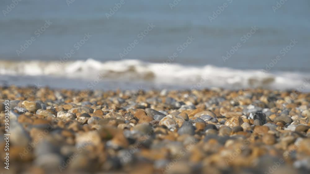 A close up view of pebble on a sea shore. A close up view of pebble on a sea shore.
