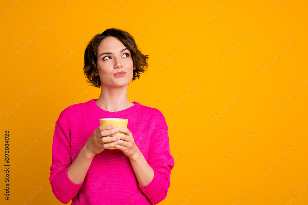Photo of minded girl hold beverage mug look copyspace think wear pullover isolated bright shine color background Photo of minded girl hold beverage mug look copyspace think wear pullover isolated bright shine color background
