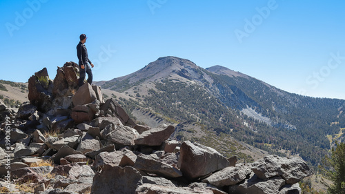 MT. ROSE, NEVADA, UNITED STATES - Sep 27, 2020: Hiker looking out at Snowflower Mountain and Mt Ros photo