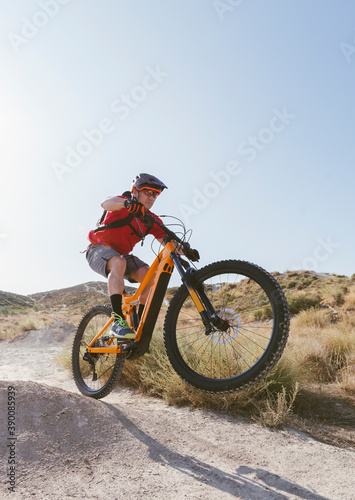 cyclist jumping with electric bike