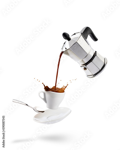 pouring coffee into cup from coffeepot with splashing photo
