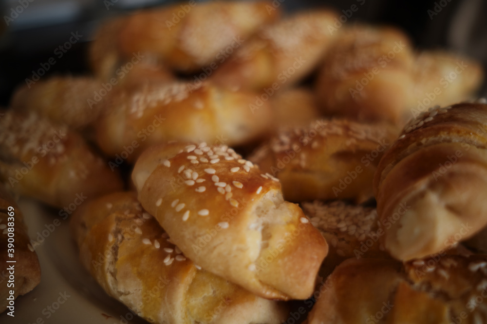 Homemade rolls with cheese and sesame. Idea for breakfast or snack. Delicious and fresh homemade rolls with cheese. Homemade rolls with cheese and sesame. Idea for breakfast or snack. Delicious and fresh homemade rolls with cheese.