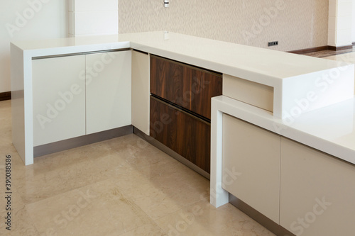 Modern kitchen  opened wooden drawers with accessories inside  solution for kitchen storage  minimalist interior design