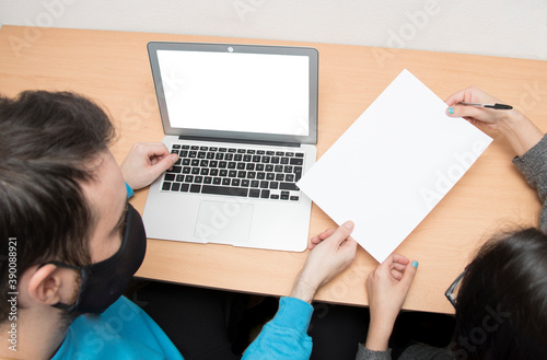 Overhead image of two people working in office