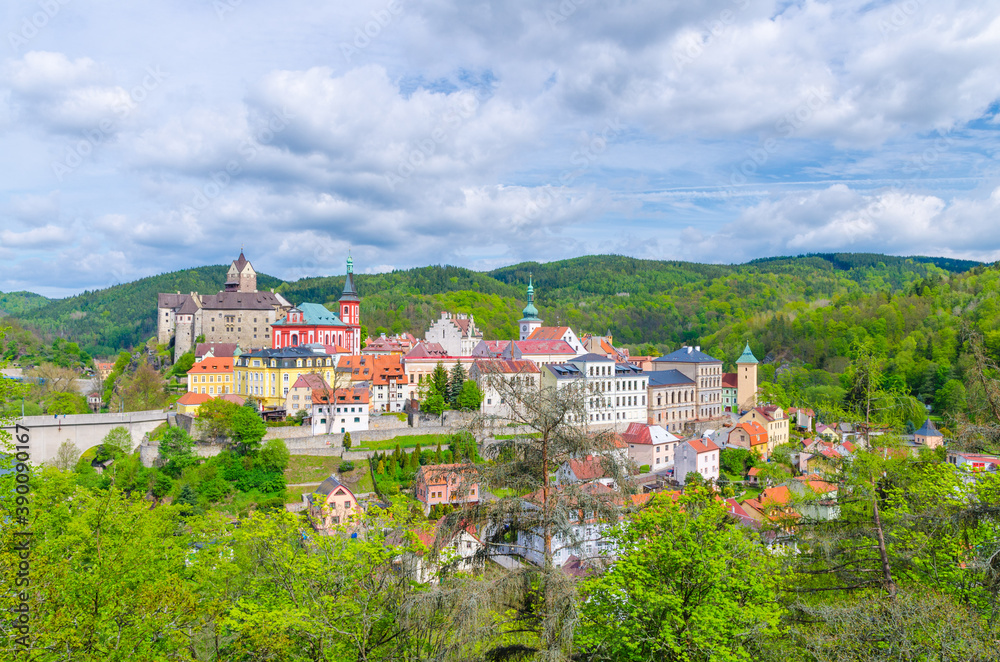 Aerial panoramic view of medieval Loket town with Loket Castle Hrad Loket gothic style on massive rock, colorful buildings, bridge over Eger river, Karlovy Vary Region, West Bohemia, Czech Republic