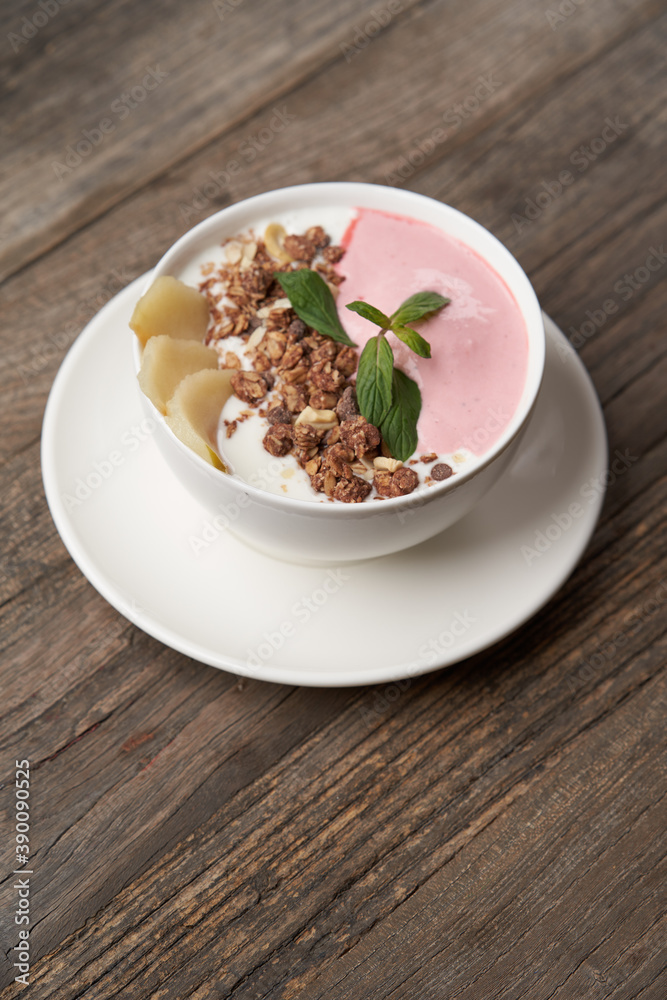 Granola with yogurt in white bowl. Healthy breakfast granola Granola with yogurt in white bowl. Healthy breakfast granola
