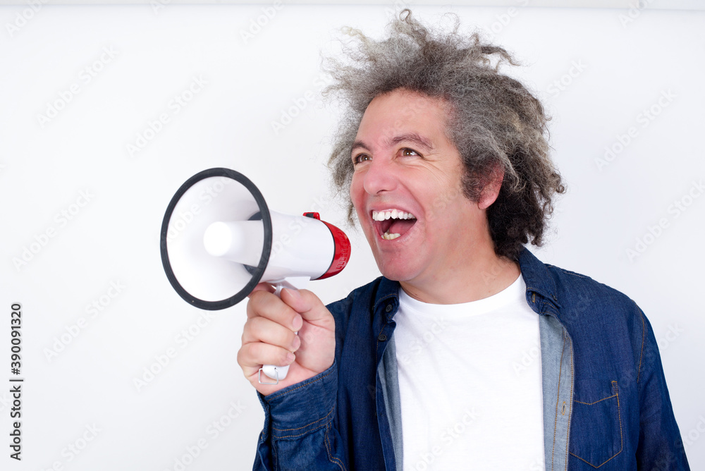 Soccer fan jumping on white background with megaphone isolated. Support and politics concept. Human emotions, facial expression concepts.
Soccer fan jumping on white background with megaphone isolated. Support and politics concept. Human emotions, facial expression concepts.